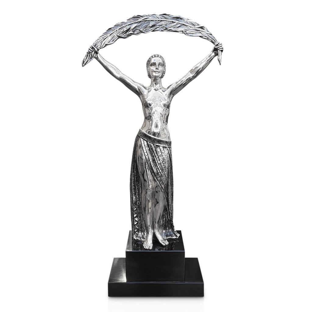 A fabulous bronze sculpture by Demetre Chiparus of a lady with a large palm leaf