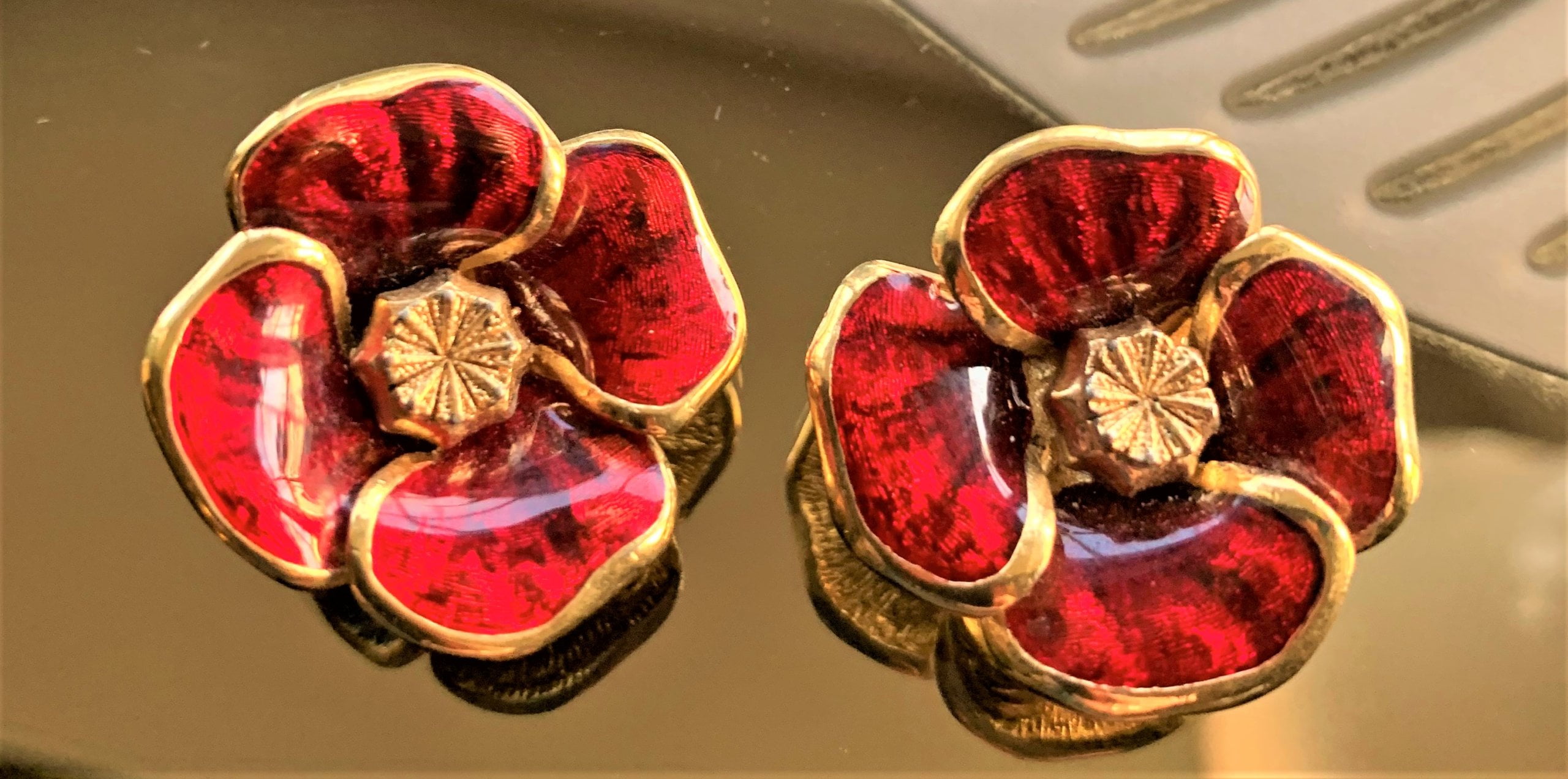 Red wild rose clip earrings by Christian Dior